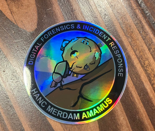 holographic sticker with a dung beetle pushing poop up a hill. The poop has DFIR mascots embedded.